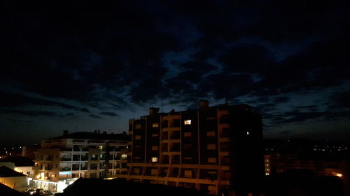 Buildings in city at night