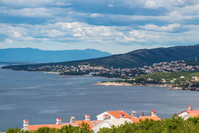 High angle view of townscape by sea