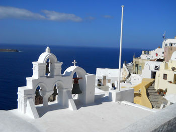 Panoramic view of sea and buildings against sky