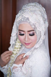 Portrait of young woman wearing hijab