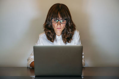Female secretary works with computer