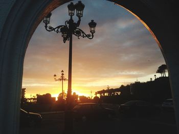 Silhouette of street light at sunset