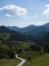 Scenic view of landscape and mountains against sky