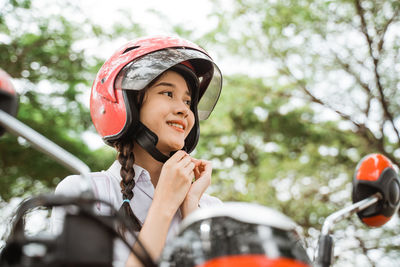 Portrait of young woman in car