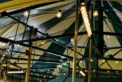 Low angle view of illuminated ferris wheel at night