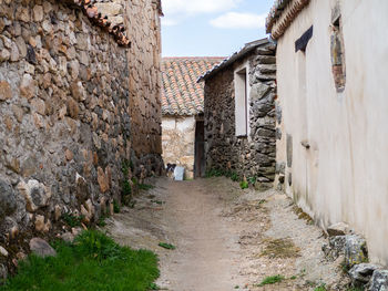 Narrow alley amidst buildings in town