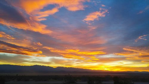 Scenic view of dramatic sky during sunset