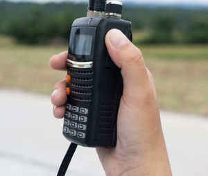 Close-up of hand holding camera