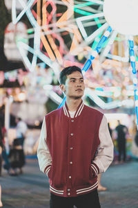 Full length of young man standing at amusement park