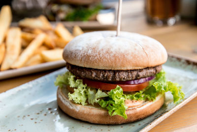 Close-up of hamburger in plate on table