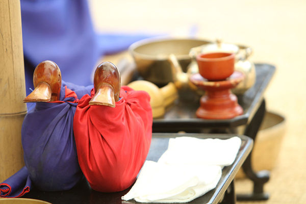 indoors, focus on foreground, sitting, rear view, men, lifestyles, food and drink, person, table, selective focus, casual clothing, red, leisure activity, incidental people, standing, restaurant, chair