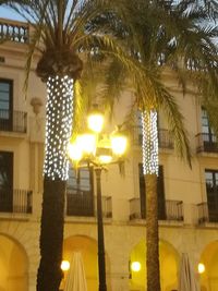 Close-up of illuminated lighting equipment at night