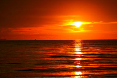 Scenic view of sea against romantic sky at sunset