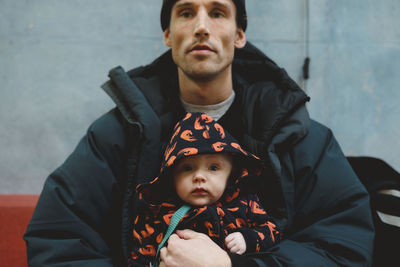 Portrait of siblings looking at camera