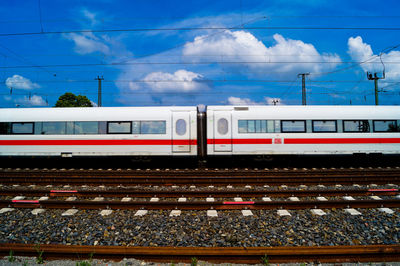 Train moving on railroad track against sky