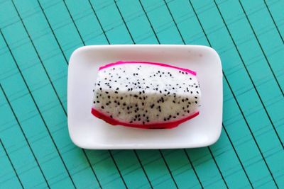High angle view of chopped dragon fruit in plate