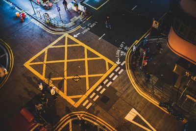 High angle view of people on city street at night