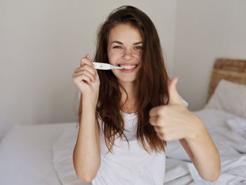 Portrait of girl holding ice cream