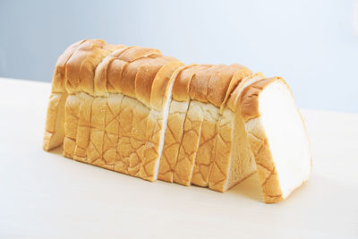 Close-up of bread on white table