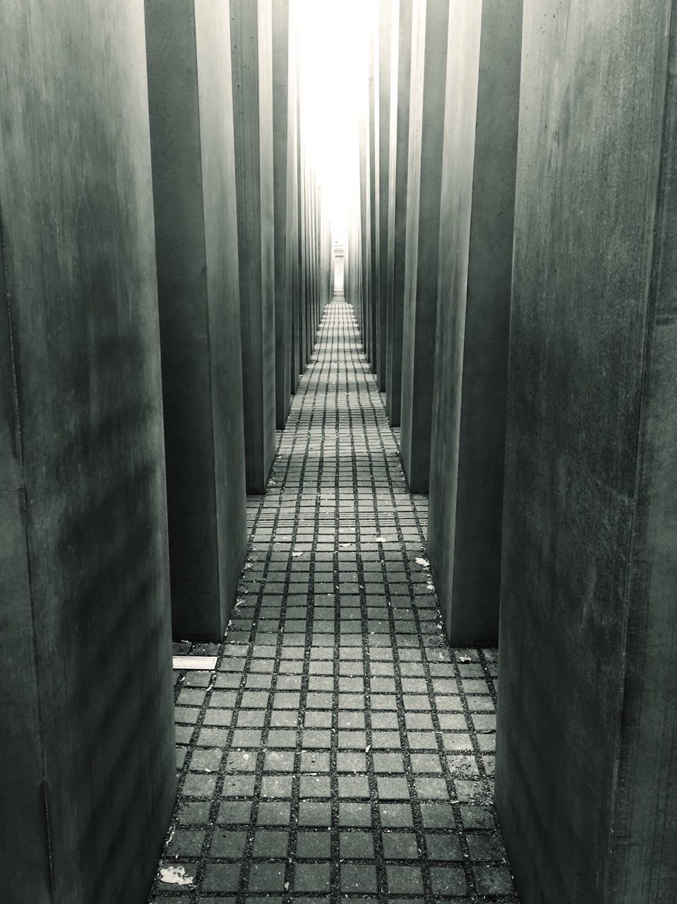 the way forward, diminishing perspective, architecture, built structure, vanishing point, in a row, narrow, day, pattern, corridor, walkway, long, indoors, sunlight, building exterior, cobblestone, footpath, wall - building feature, stone material