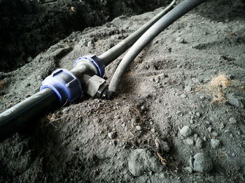 High angle view of pipes on rock