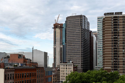 Low angle view of buildings in city against sky