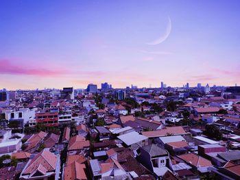 High angle view of buildings against sky during sunset