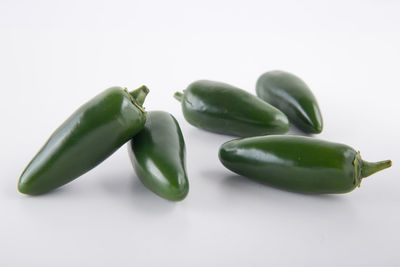 Close-up of green pepper against white background