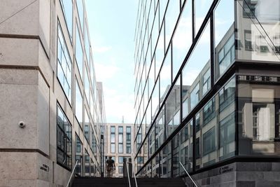 Low angle view of modern buildings against sky