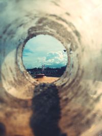 Close-up of cityscape seen through hole