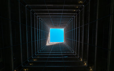 Directly below shot of illuminated building against clear sky at night