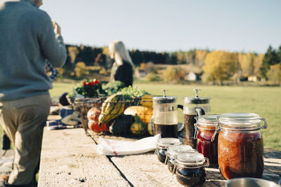 Food preserves and vegetables displayed for sale at farmer's market