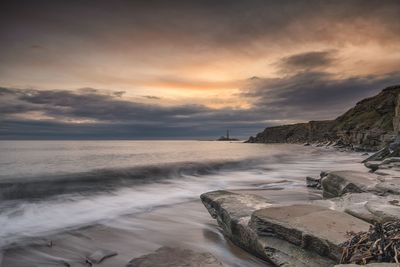 Scenic view of sea against sky during sunset