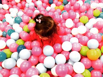 High angle view of woman with colorful balloons