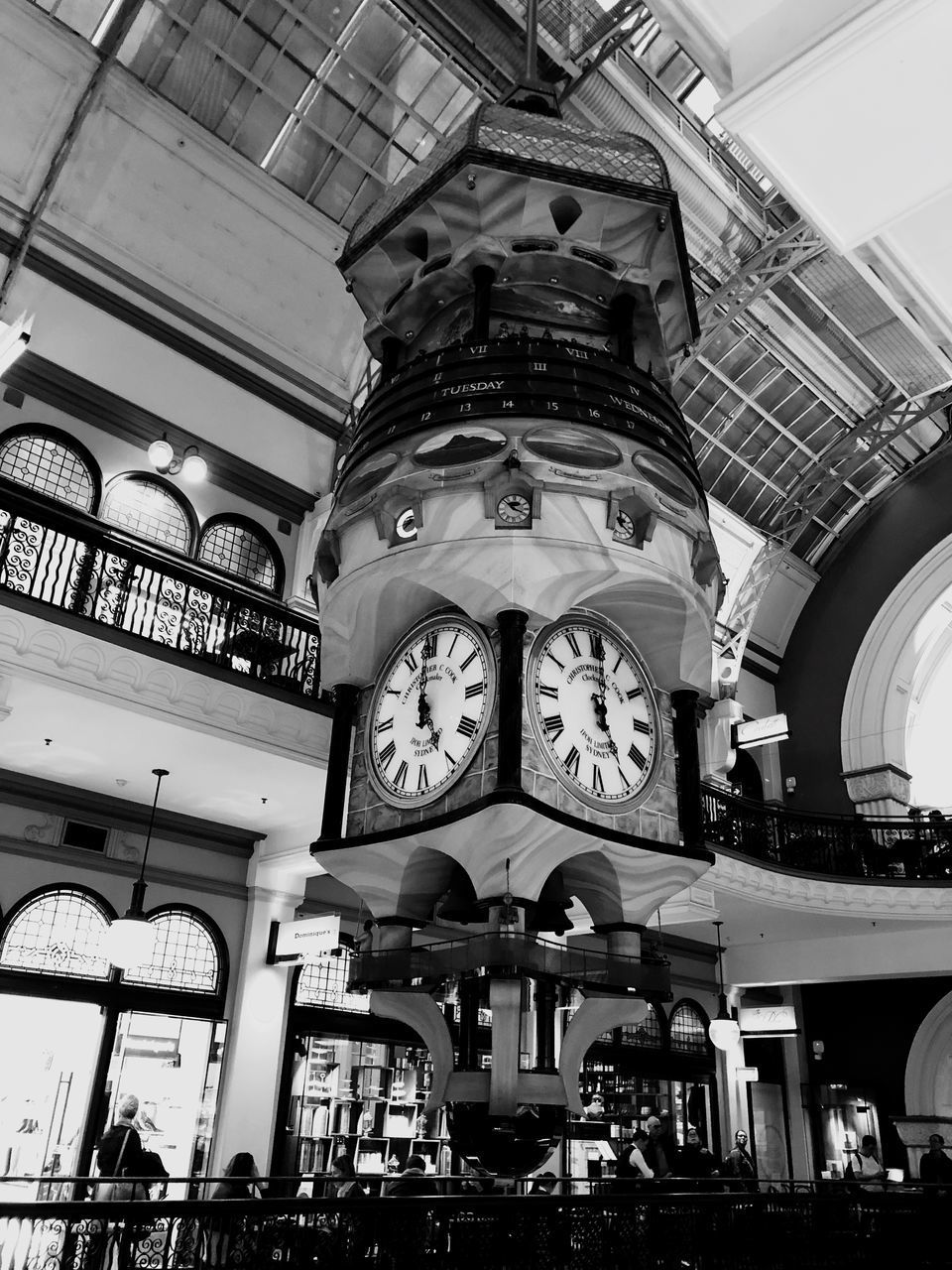 LOW ANGLE VIEW OF CLOCK IN ILLUMINATED BUILDING