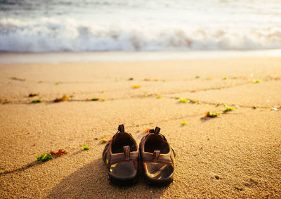 Pair of sandals on sand