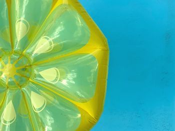 Full frame shot of yellow blue water on swimming pool