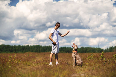 Full length of dog on field