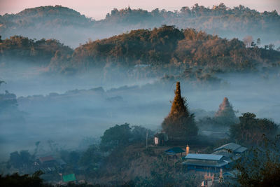 High angle view of trees and buildings against sky