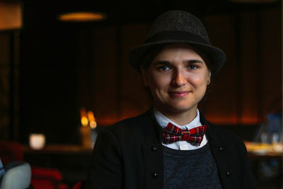 Woman wearing in british or english style clothes. masculine woman. young smiling woman wearing hat