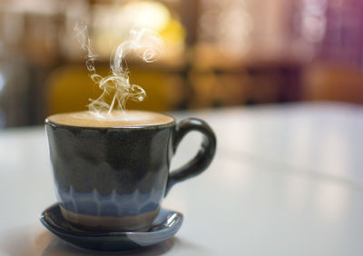 Close-up of coffee cup on table