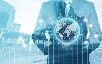 Digital composite image of hand on glass