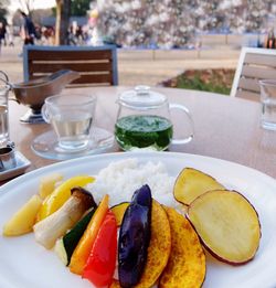 Close-up of grill vegetables served on outdoor table 