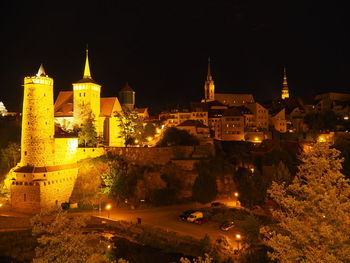 Illuminated buildings in city at night