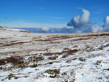 Scenic view of snowcapped mountains against sky