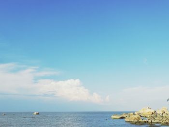 Scenic view of sea against blue sky