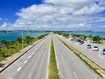 Highway by street against sky