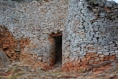 Low angle view of old brick wall