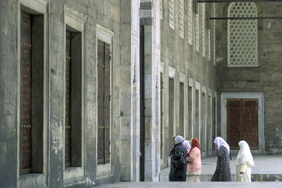 People sitting outside building