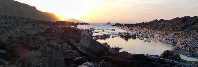 Panoramic view of sea against sky during sunset